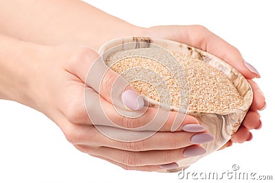 Wheat porridge millet hand Stock Photo