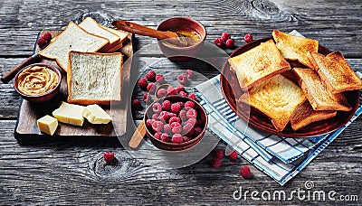 Wheat toasts, butter, peanut butter, fresh berries Stock Photo