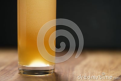 Wheat unfiltered beer poured into glass on wood board Stock Photo