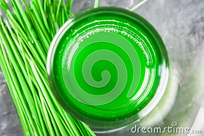 Wheatgrass shot. Juice from wheat grass. Trend of health. Stock Photo