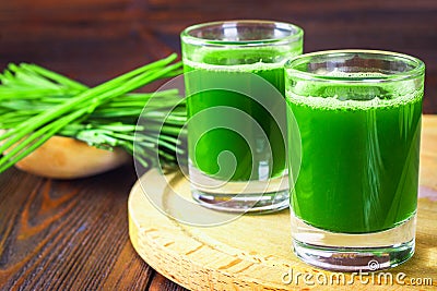 Wheatgrass shot. Juice from wheat grass. Trend of health. Stock Photo