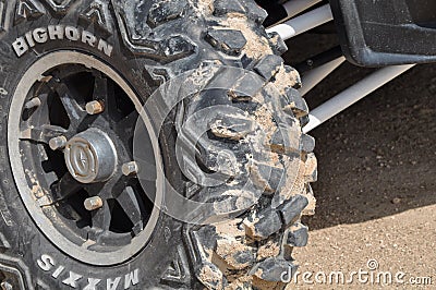 Wheel of all terrain vehicle buggy for racing across desert dunes after safari journey. Abu Dhabi,UAE, Jan 2022 Editorial Stock Photo