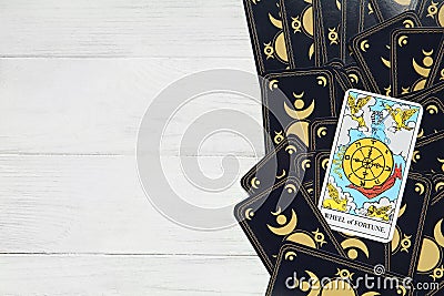 The Wheel of Fortune and other tarot cards on white wooden table, top view. Space for text Stock Photo