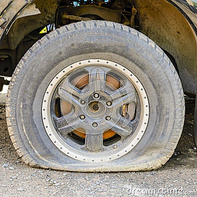 Wheel is lowered in consequence of the inactivity of the car, age, cut or puncture tires. tire work Stock Photo