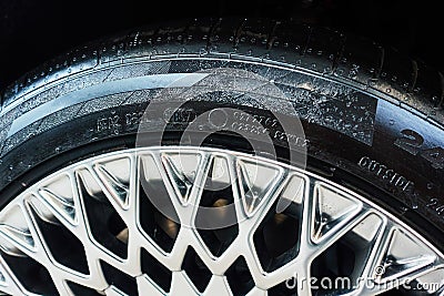Wheel of a modern car with part of rim and tyre Stock Photo