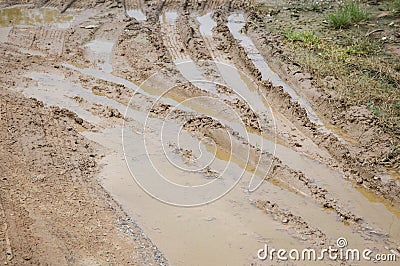 Wheel track on dirt soil texture after rainning Stock Photo