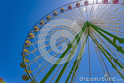 Wheel in the wheel. A round rainbow around the Ferris wheel. Stock Photo