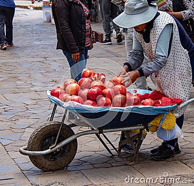 Wheelbarrow Full of Pomegranate in Cusco Editorial Stock Photo