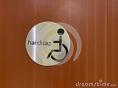 wheelchair handicap sign disabled symbol on wooden background Stock Photo