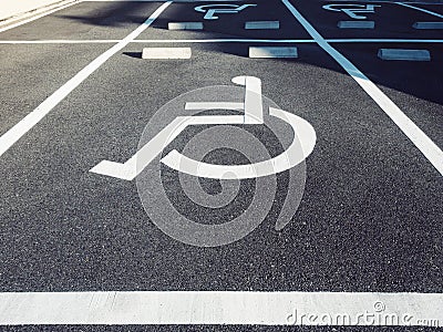 Wheelchair Handicap Sign at Parking lot Stock Photo