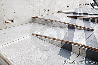 Wheelchair ramp with red carpet for easy access in building Stock Photo