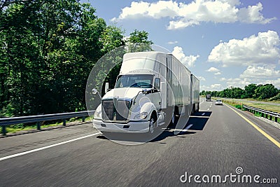 18 wheeler semi-truck on highway road beautiful day Stock Photo