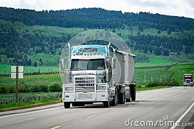 18 wheeler semi truck delivering cargo on the road Stock Photo