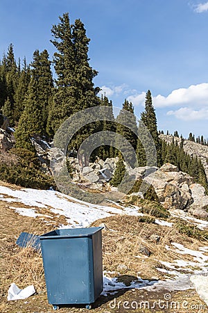 Wheelie bin in the mountains Stock Photo