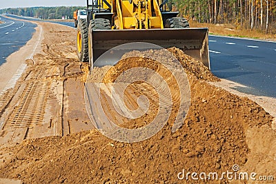 Wheelloader working with sand Stock Photo
