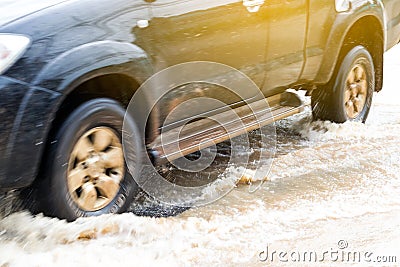 Wheels car sped through flooded. Stock Photo