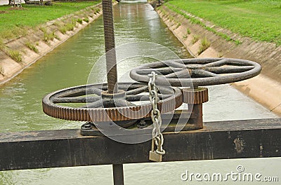 Wheels and cogs for floodgate controlling with lock Stock Photo