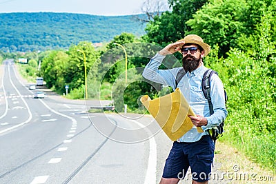 Where should I go. Expeditor looking for side of the world direction map. Expeditor backpacker map look direction Stock Photo