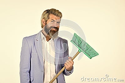 Where start cleaning. Clear reputation. Hipster hold cleaning tool. Man use broom. Businessman sweeping office Stock Photo