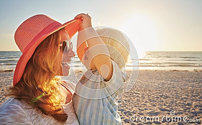 Wheres mommy Theres mommy. a mother and son having fun at the beach. Stock Photo