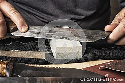 Whetstone which sharpen the knife. Stock Photo