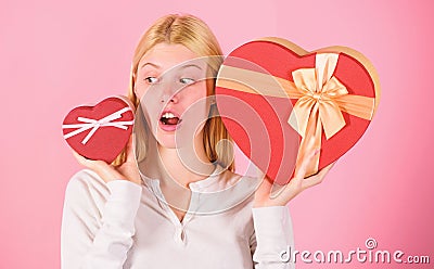 Which one she prefer. Girl decide which gift she like more. Big surprise and small gift. Make choice. Romantic gift for Stock Photo