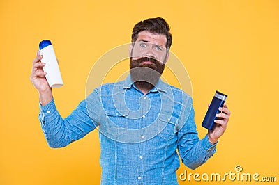Which shampoo is better for beard. Bearded man choose shampoo for beard hair. Beard products. Care of beard and Stock Photo