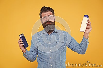 Which shampoo is better for beard. Bearded man choose shampoo for beard hair. Beard products. Care of beard and Stock Photo