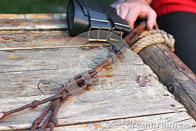 male tough hand with a whip Stock Photo
