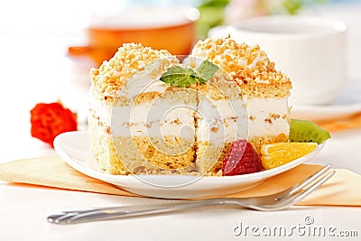 Whipped cream cake garnished with fruit pieces Stock Photo