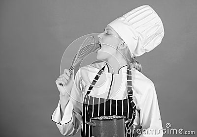 Whipping like pro. Girl in apron whipping eggs or cream. Start slowly whisking whipping or beating cream. Whipping cream Stock Photo