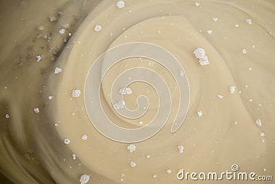 Whirpool in cappuccino color with white bubbles Stock Photo