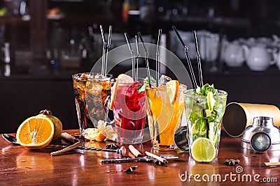 Assorted cocktails in glass glasses on a wooden stand Stock Photo