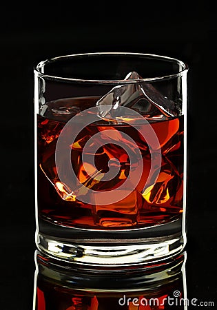 Whiskey glass on black background Stock Photo