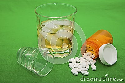 Whiskey alcohol liquor abuse prescription drugs pills drug habit Stock Photo