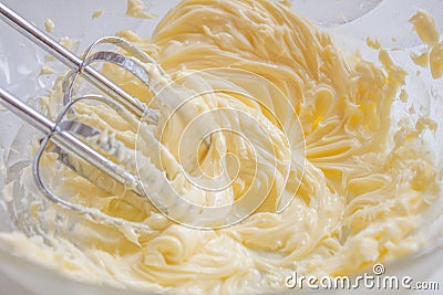 Whisking butter Stock Photo