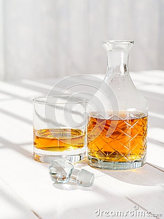 Whisky decanter and rocks glass Stock Photo