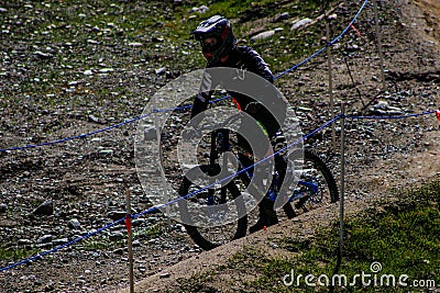 Whistler Canada, June 16 2018: editorial photo of a person riding their mountain bike on whistler mountain. The summer attracts Editorial Stock Photo