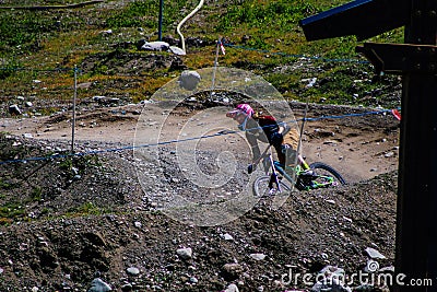 Whistler Canada, June 16 2018: editorial photo of a person riding their mountain bike on whistler mountain. The summer attracts Editorial Stock Photo