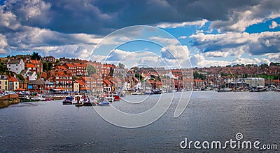 Whitby abbey is a seaside town and port at daytime in North Yorkshire, UK Stock Photo