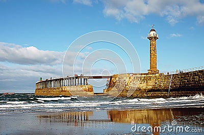 Whitby Pier and light house Stock Photo