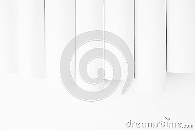 White abstract geometric background with soft light vertical smooth tubes or stripes as pattern, border with copy space. Simple. Stock Photo