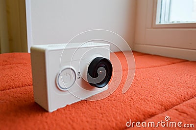 White action camera with a large lens Stock Photo