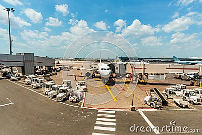White airplane parked on airport Editorial Stock Photo