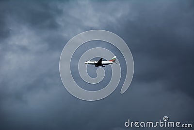 White Airplane in the Sky Stock Photo