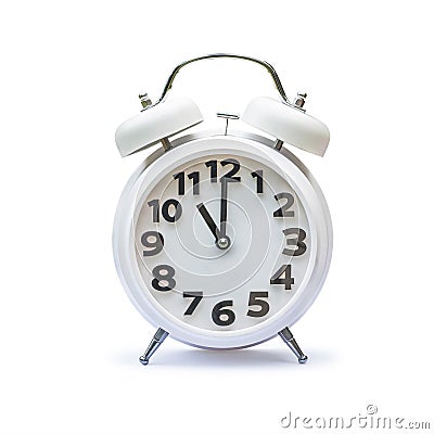 White alarm clock at 11 eleven o`clock isolated on white background clipping path Stock Photo