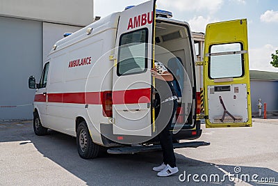 White ambulance, emergency medical service van with opened back door Editorial Stock Photo