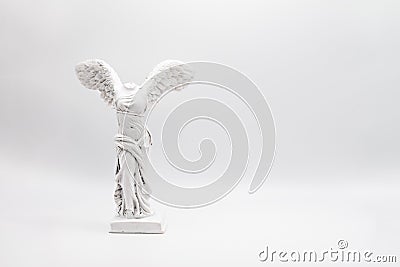 White angelic figure with wings on the white background Stock Photo