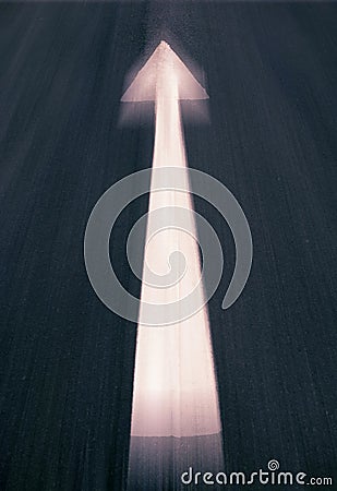 White arrow painted on road Stock Photo