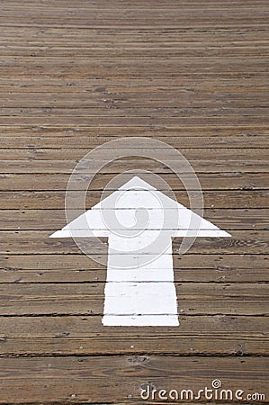 White arrow on pier Stock Photo